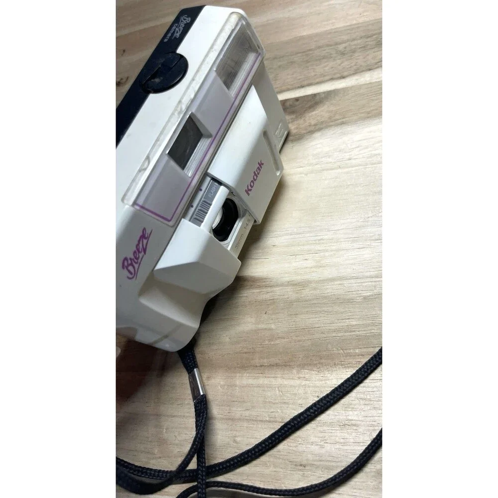 Kodak White Breeze Point-and-Shoot Camera with Black Strap and Pink Accents